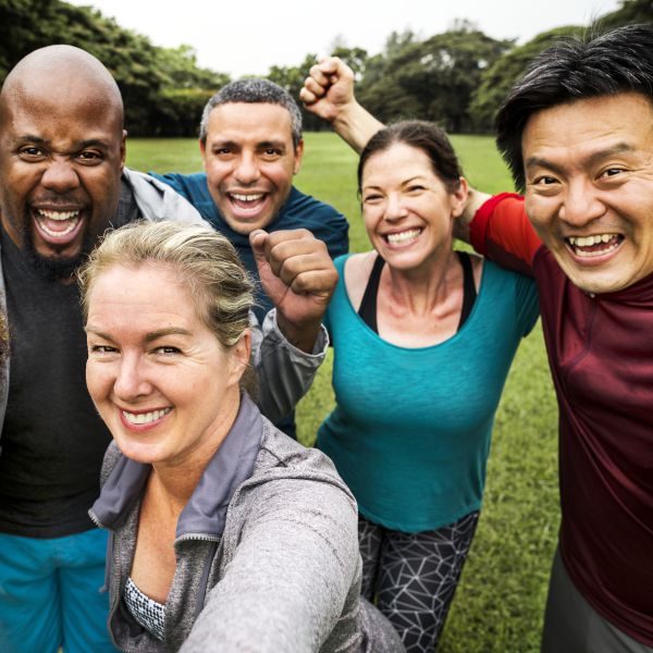 Group of cheerful diverse friends in the park